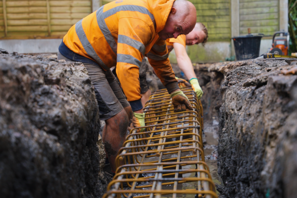 Lifting the steel cage in for a piled extension in Stockport, Piling in Marple
